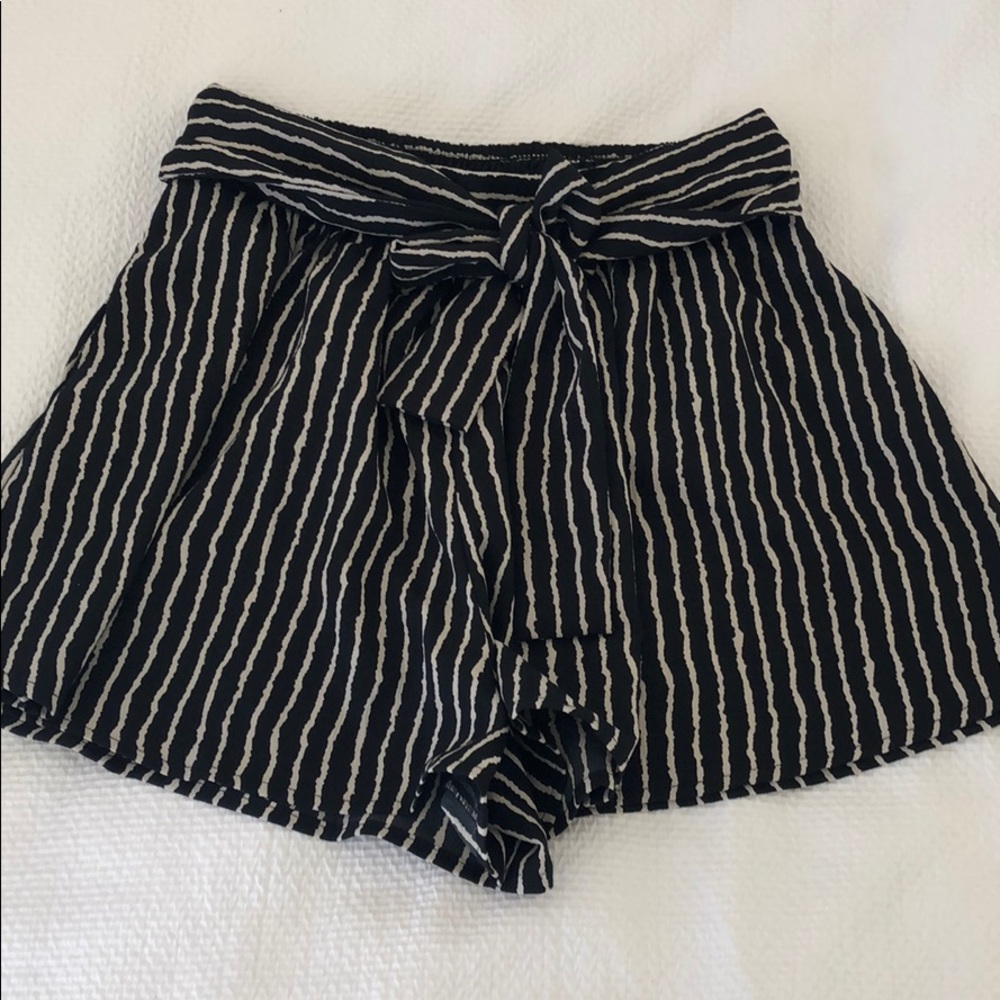 Black and cream striped shorts with belted waist